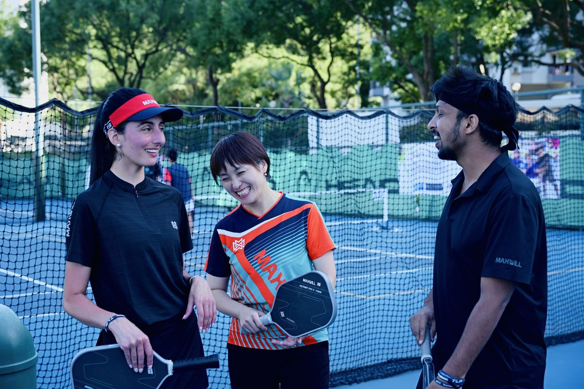 With fellow players at the net